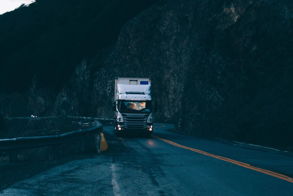 silver Scania truck driving empty